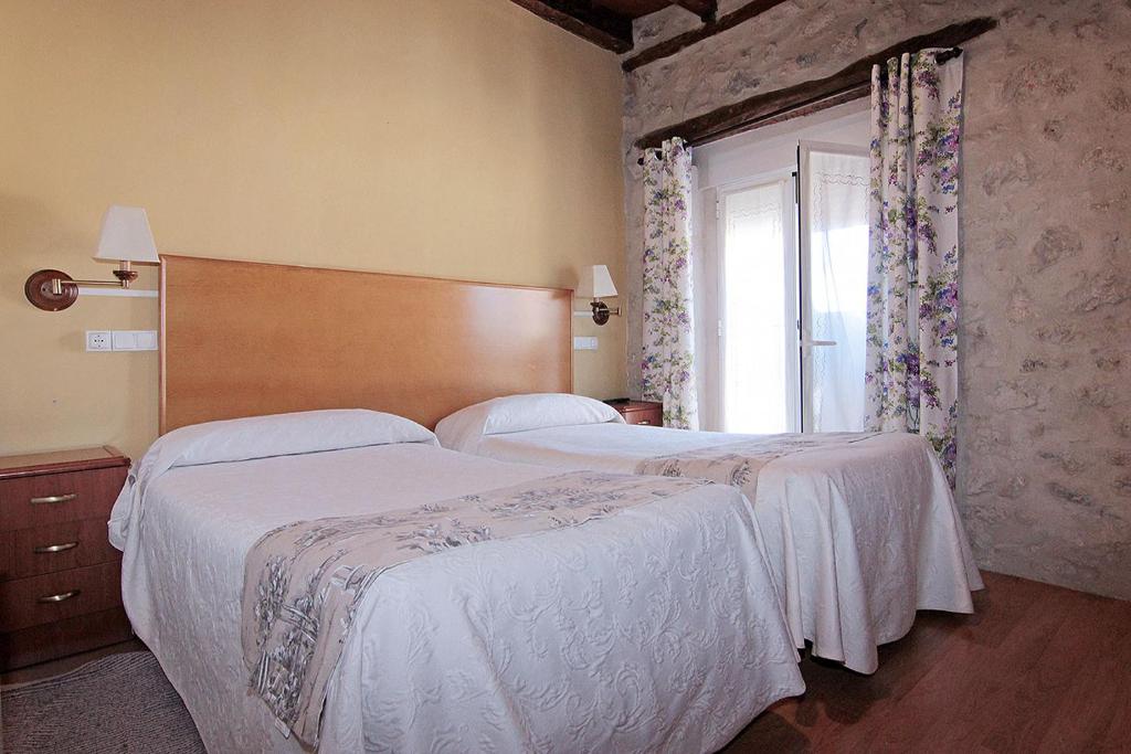 Posteľ alebo postele v izbe v ubytovaní HOTEL RURAL LOS ABUELOS