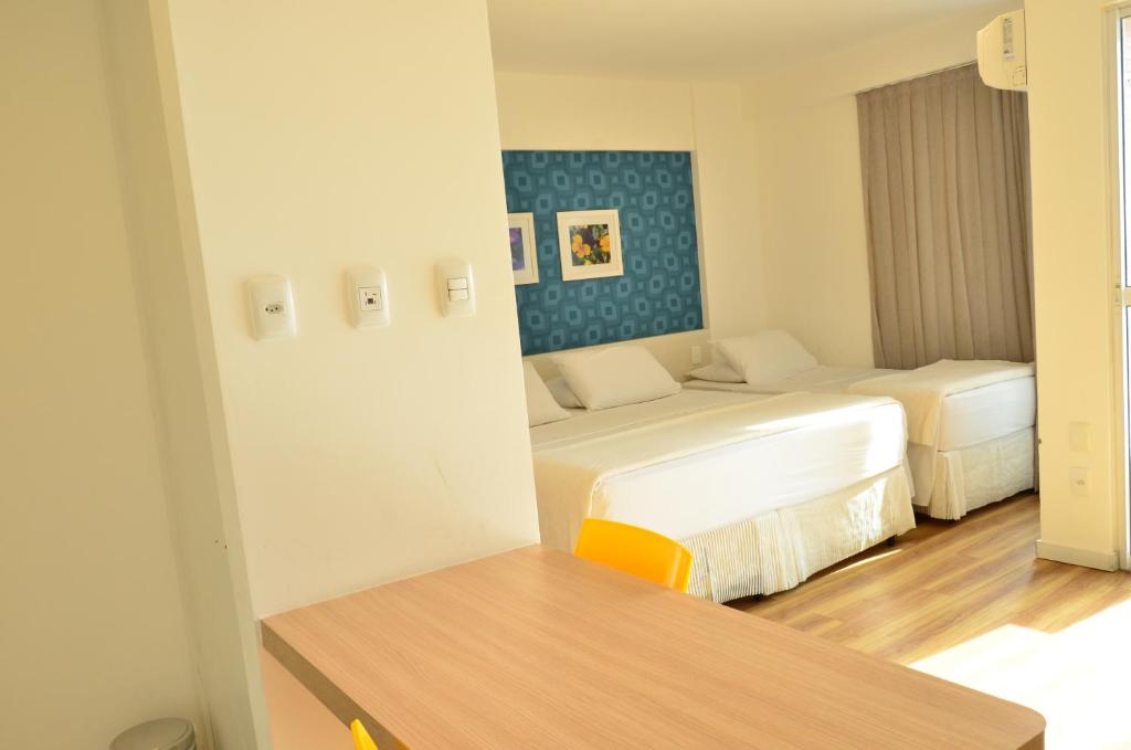 Postel nebo postele na pokoji v ubytování Unico Apart Hotel