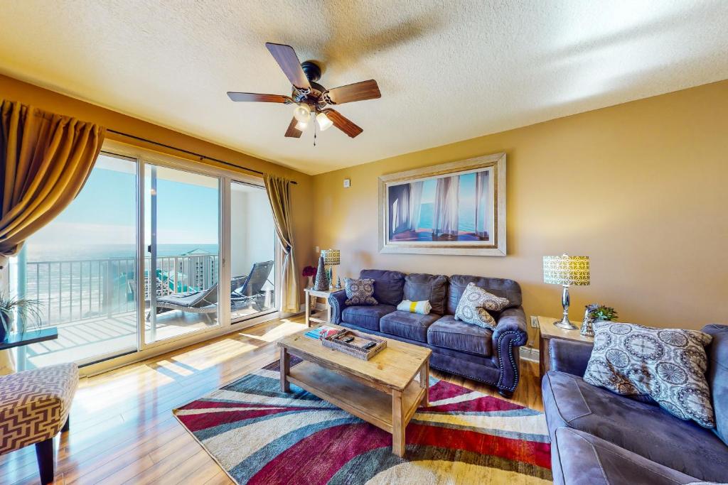 a living room with a couch and a ceiling fan at Ariel Dunes I 1709 in Destin
