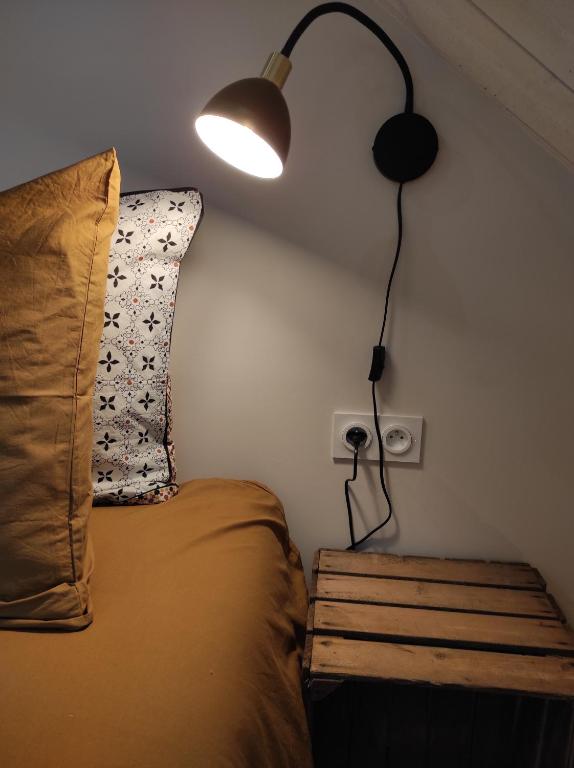 Postel nebo postele na pokoji v ubytování Le Grenier - Chambre d'hôtes