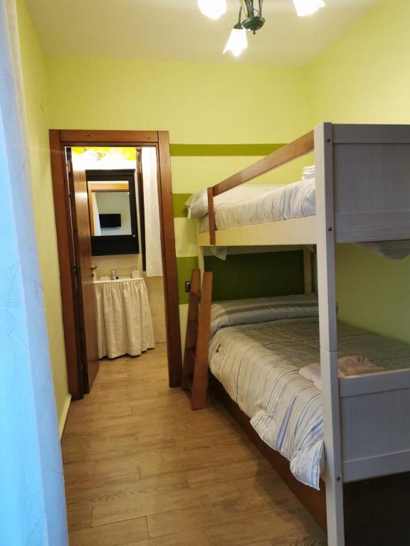 Postel nebo postele na pokoji v ubytování La Cerca