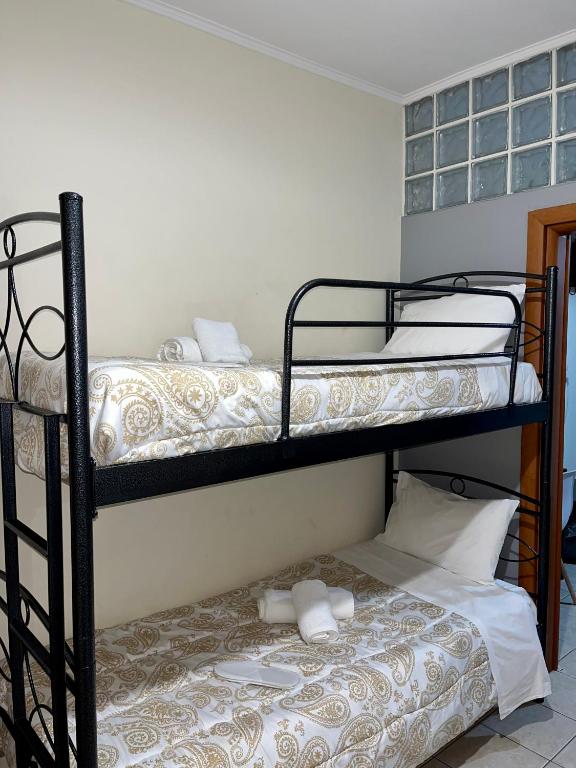 Postel nebo postele na pokoji v ubytování Pinpoint Rooms