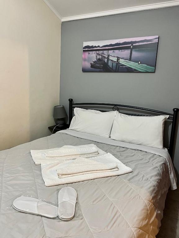 Postel nebo postele na pokoji v ubytování Pinpoint Rooms