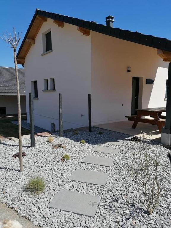 a stone pathway in front of a house at Les Catèdjes in Fraize