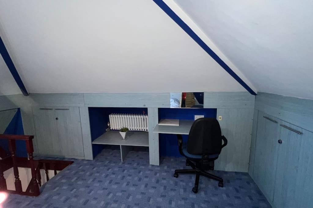 a office with a desk and a chair in a room at Palaz 6 - 2 bedroom flat in Edmonton