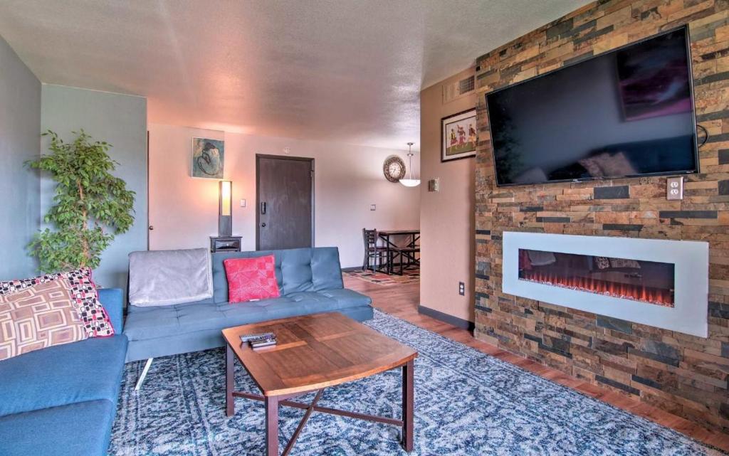 a living room with a blue couch and a brick fireplace at 5124 Williams Fork in Boulder