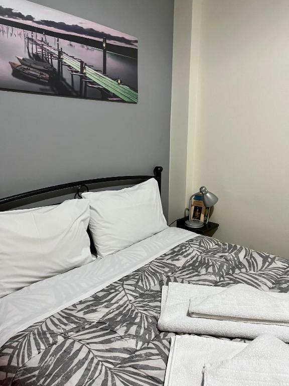 Postel nebo postele na pokoji v ubytování Pinpoint Rooms