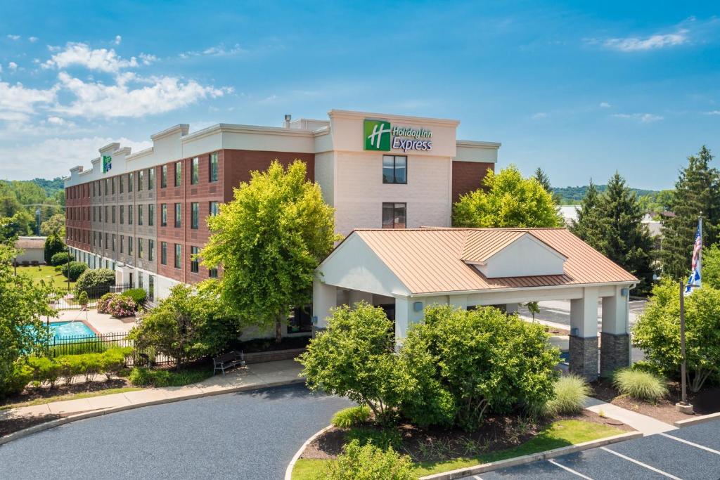 an image of a hotel with a parking lot at Holiday Inn Express Exton - Great Valley, an IHG Hotel in Exton