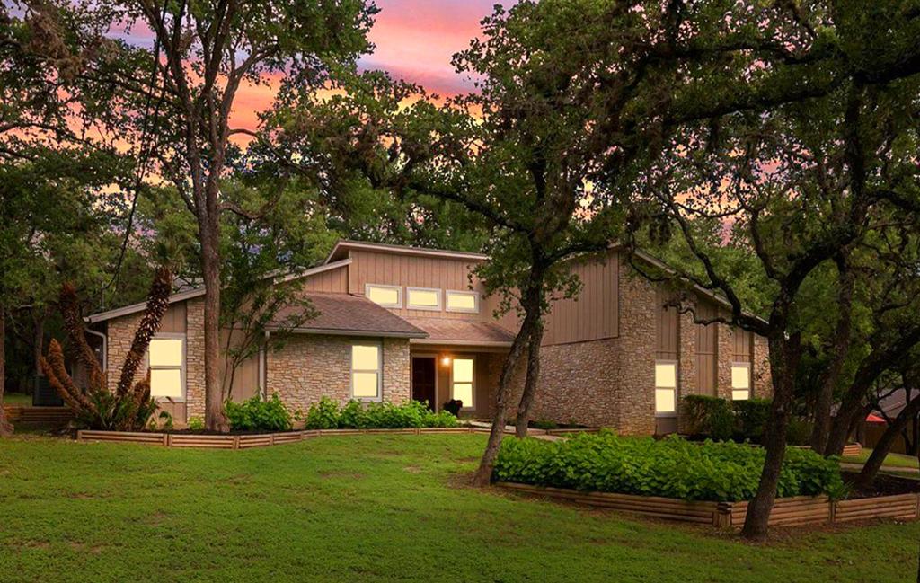 a large brick house with trees in a yard at King Bed in Relaxing Oasis, with FREE Snack/Wi-Fi/Parking in San Marcos