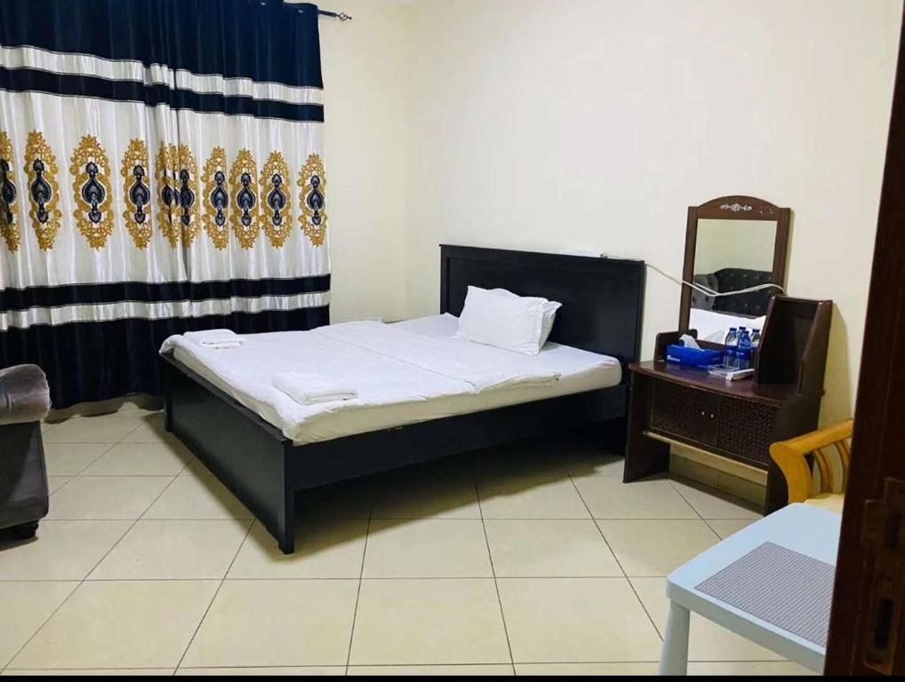 Postel nebo postele na pokoji v ubytování Jin Jie Residence