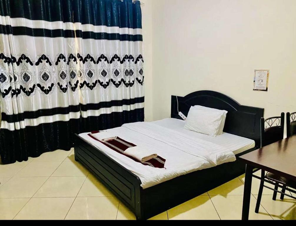 Postel nebo postele na pokoji v ubytování Jin Jie Residence