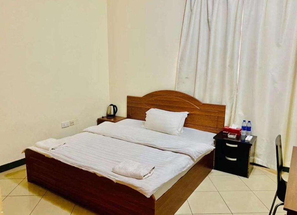 Postel nebo postele na pokoji v ubytování Jin Jie Residence