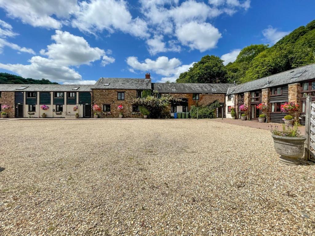 an empty driveway in front of a building at Duvale Barn in Bampton