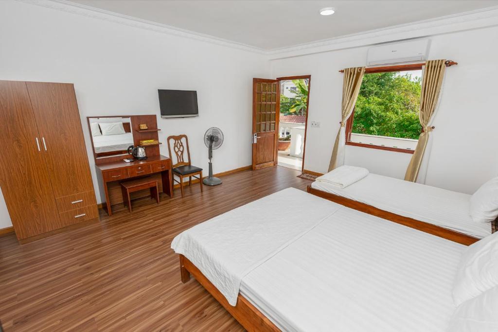 Postel nebo postele na pokoji v ubytování Caroline Resort