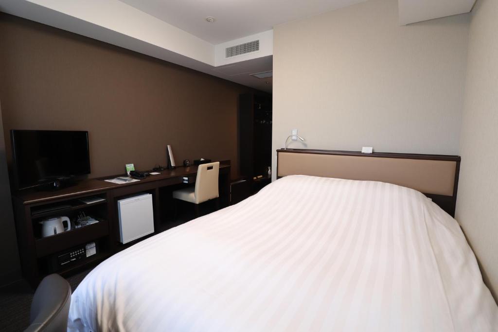Postel nebo postele na pokoji v ubytování Silk Hotel