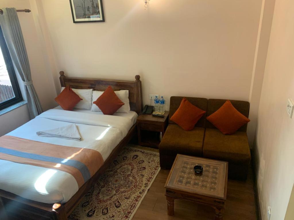Postel nebo postele na pokoji v ubytování Hotel Ramanam