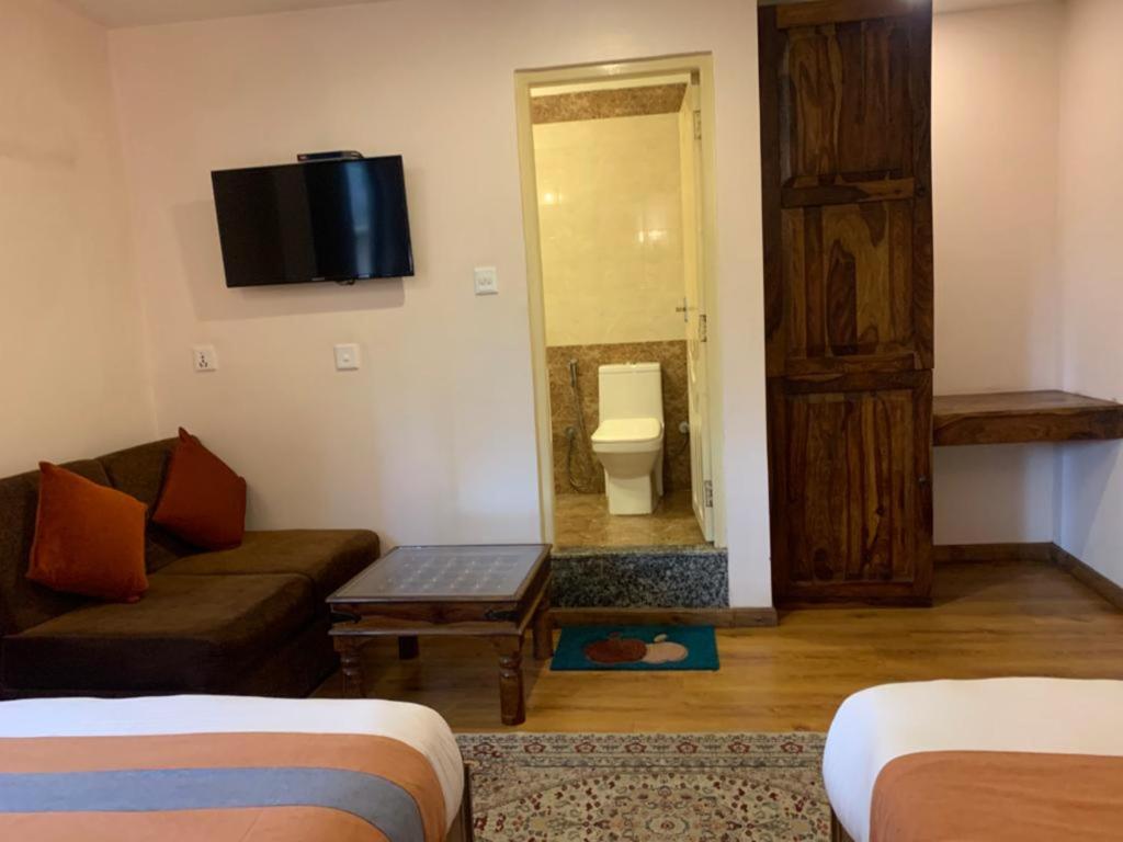 Postel nebo postele na pokoji v ubytování Hotel Ramanam