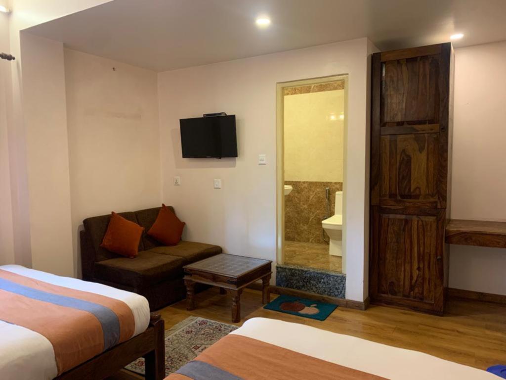 Postel nebo postele na pokoji v ubytování Hotel Ramanam