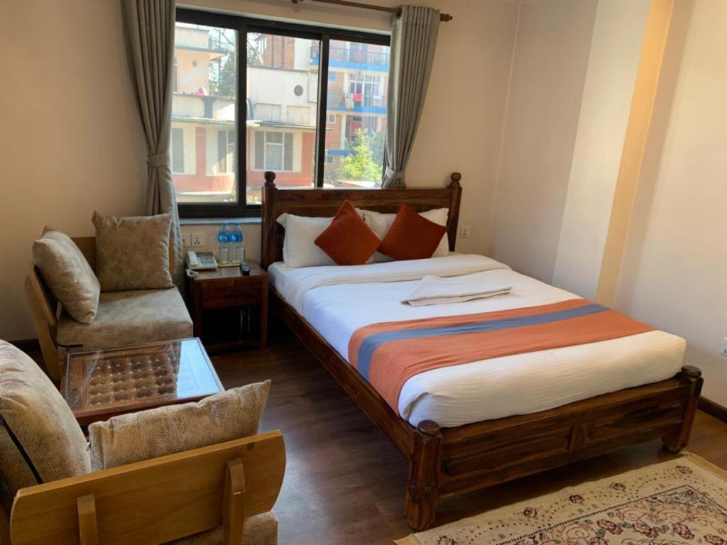 Postel nebo postele na pokoji v ubytování Hotel Ramanam