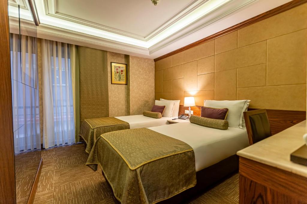 Postel nebo postele na pokoji v ubytování Eurostars Hotel Old City