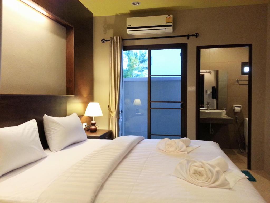 Postel nebo postele na pokoji v ubytování Purimas Resortel
