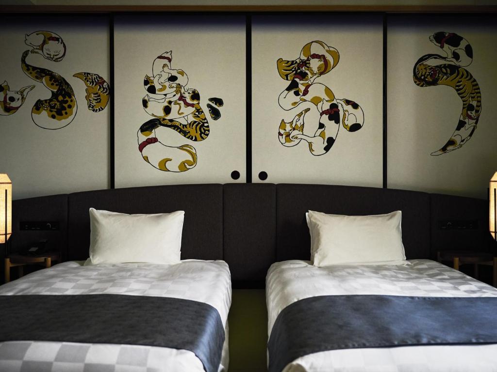 Postel nebo postele na pokoji v ubytování Asakusa View Hotel Annex Rokku