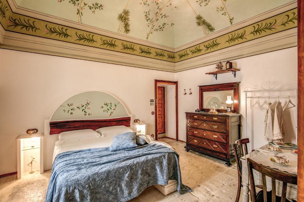 Llit o llits en una habitació de Palazzo Stunis - Dimora di Charme