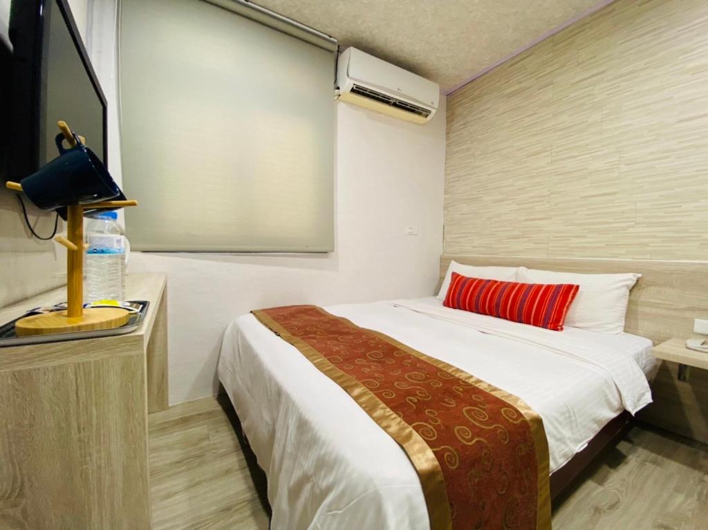 Postel nebo postele na pokoji v ubytování Beauty Garden Hotel - Jiaoxi