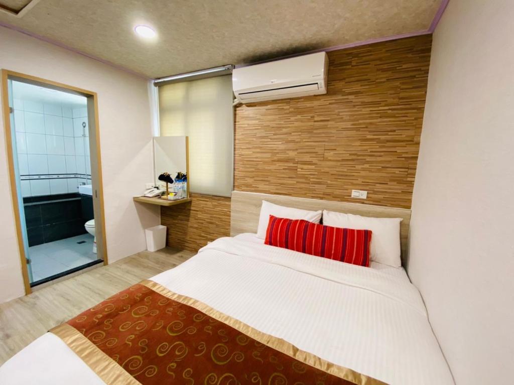 Postel nebo postele na pokoji v ubytování Beauty Garden Hotel - Jiaoxi