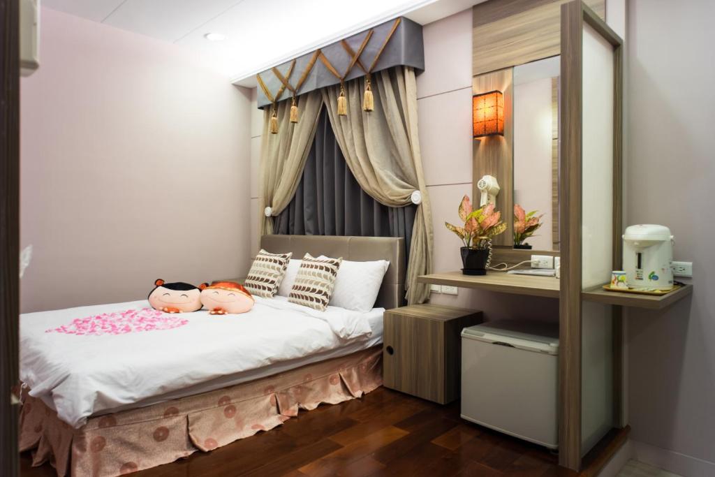 Postel nebo postele na pokoji v ubytování Bei Pin B&B