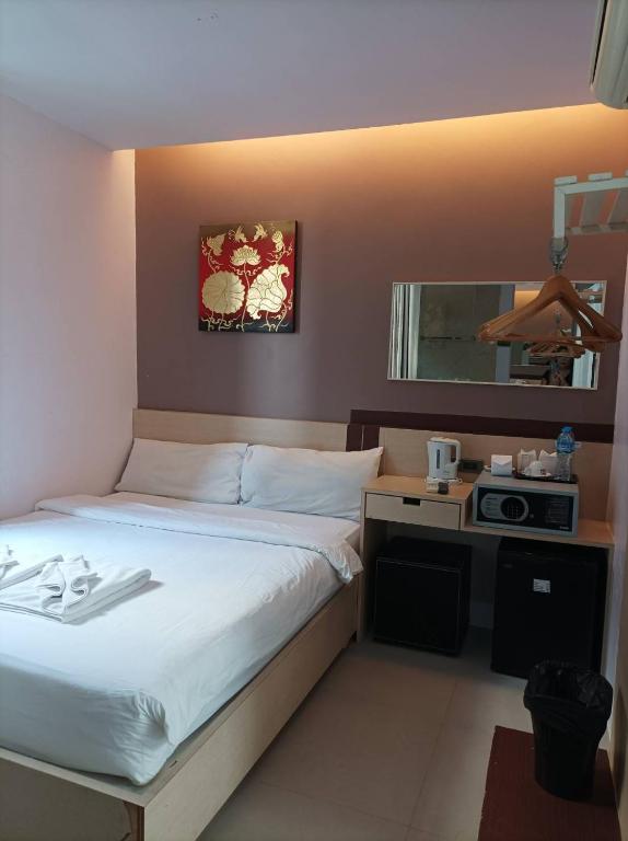 Postel nebo postele na pokoji v ubytování My Hotel Phuket