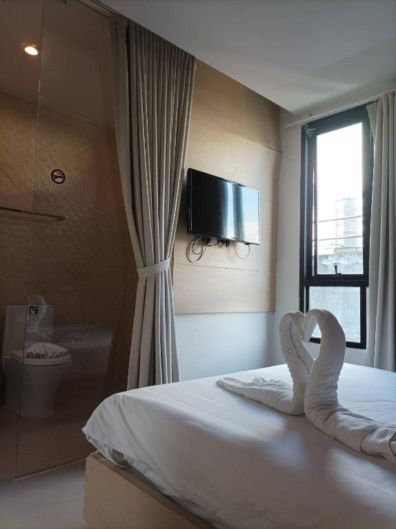 Postel nebo postele na pokoji v ubytování My Hotel Phuket