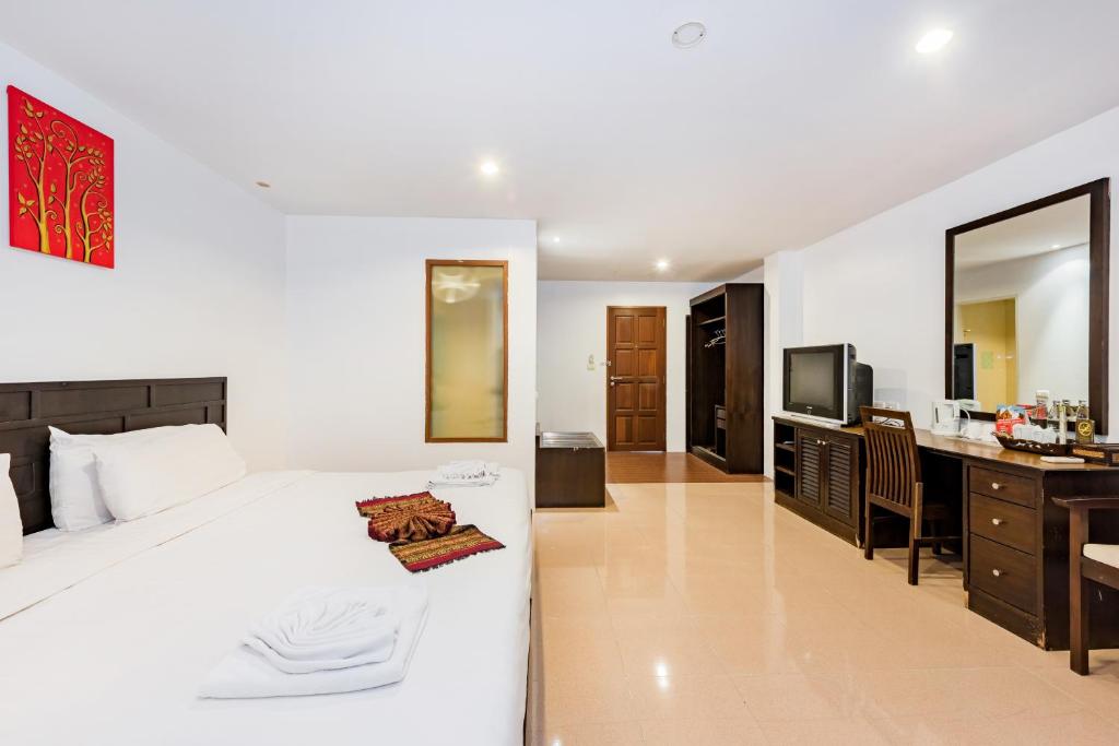 Postel nebo postele na pokoji v ubytování My Hotel Phuket
