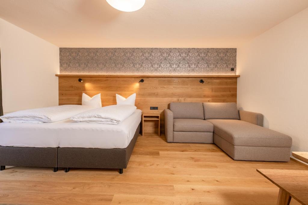 Postel nebo postele na pokoji v ubytování Pension Gulla - Ferienhaus Appartements B&B