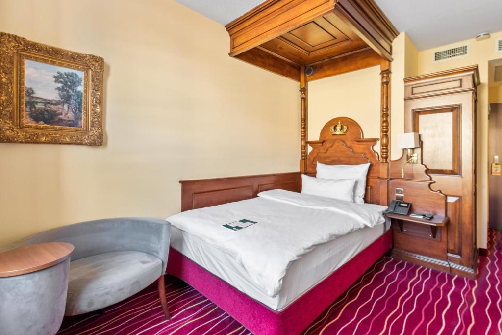 Postel nebo postele na pokoji v ubytování KING's Hotel First