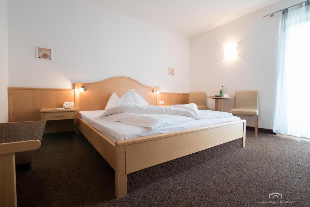 Postel nebo postele na pokoji v ubytování Kreuzstein Bed&Breakfast