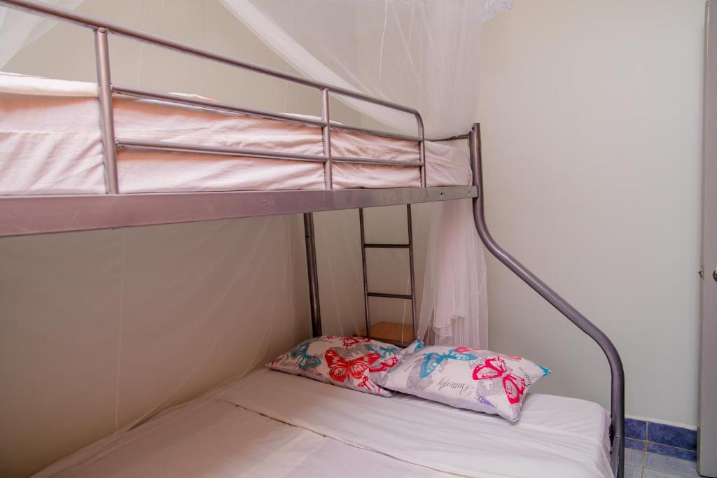 Postel nebo postele na pokoji v ubytování Nairobi Airport Apartments