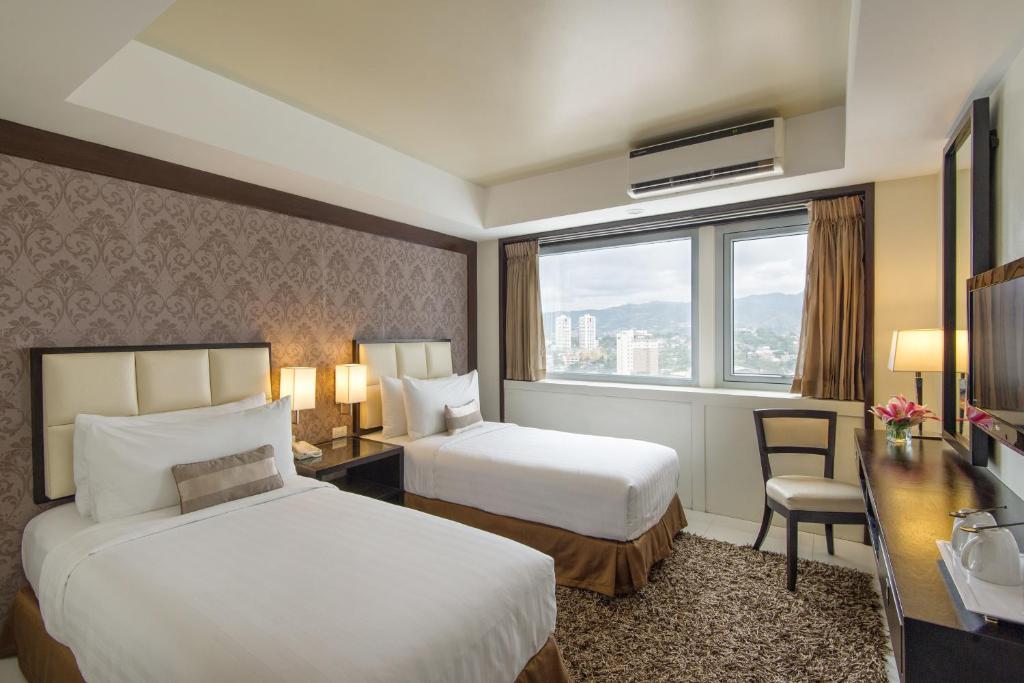 Katil atau katil-katil dalam bilik di Quest Hotel & Conference Center Cebu