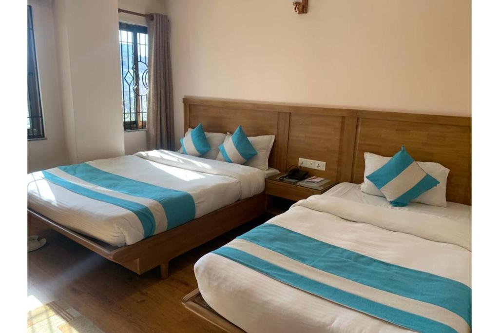 Postel nebo postele na pokoji v ubytování Hotel Tapas