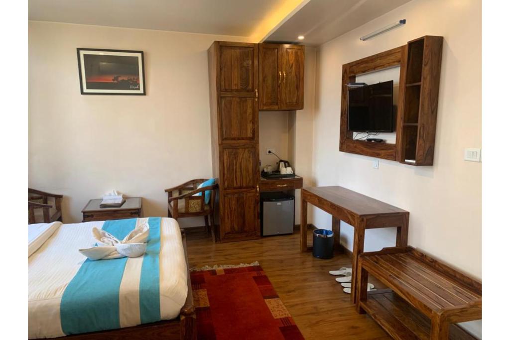 Postel nebo postele na pokoji v ubytování Hotel Tapas