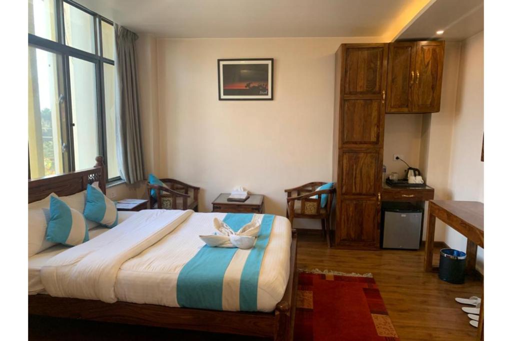 Postel nebo postele na pokoji v ubytování Hotel Tapas