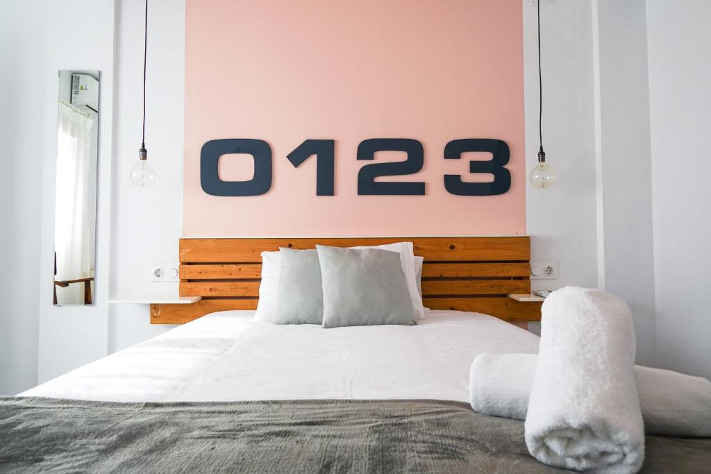 Кровать или кровати в номере Torres de Serrano Apartment
