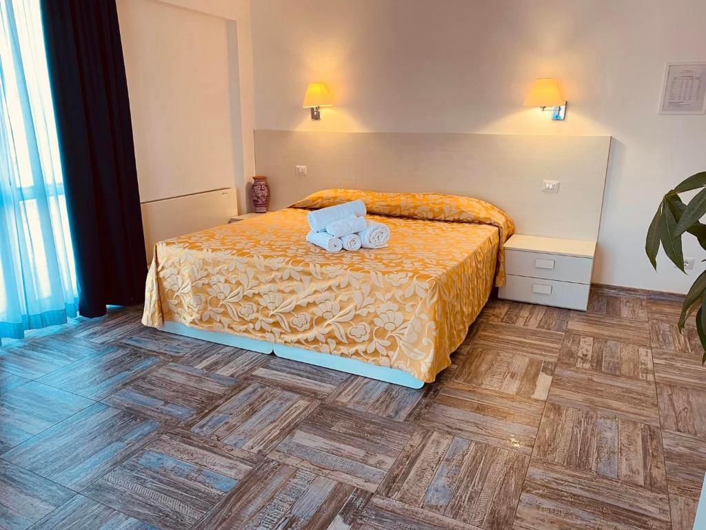 Postel nebo postele na pokoji v ubytování Hotel Muita di Mari