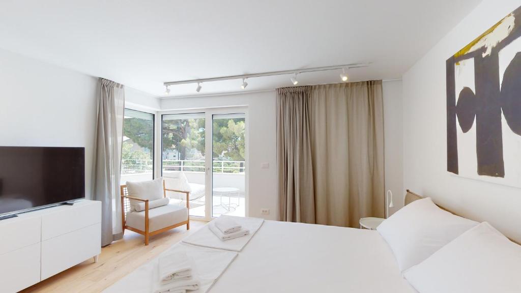 Postel nebo postele na pokoji v ubytování Villa Zoe Suites