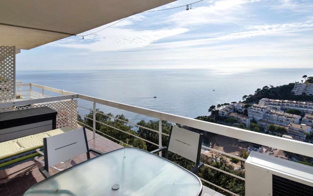 a bath tub on a balcony with a view of the ocean at Xalupa Salions Vistas in Tossa de Mar