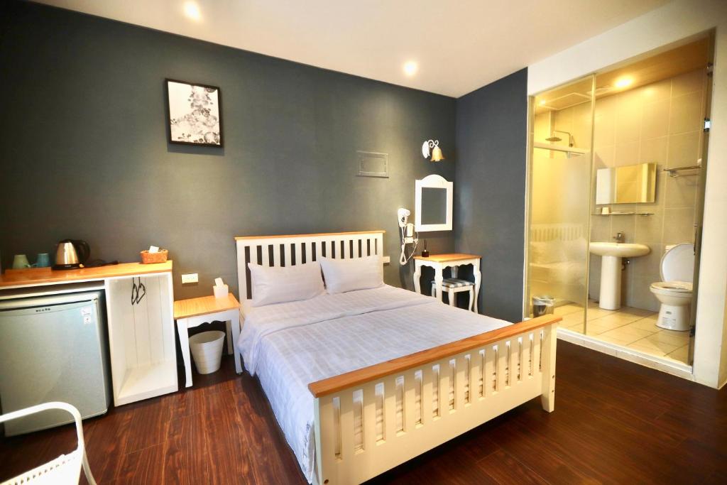 Cama o camas de una habitación en 好窩旅店