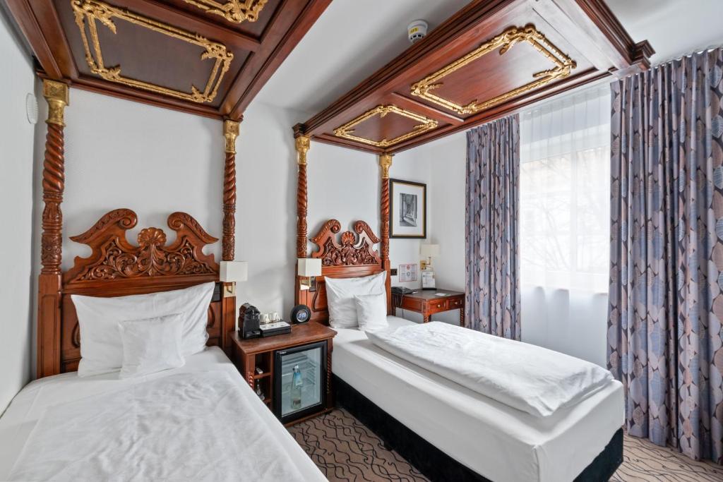 Postel nebo postele na pokoji v ubytování King's Hotel Center Superior