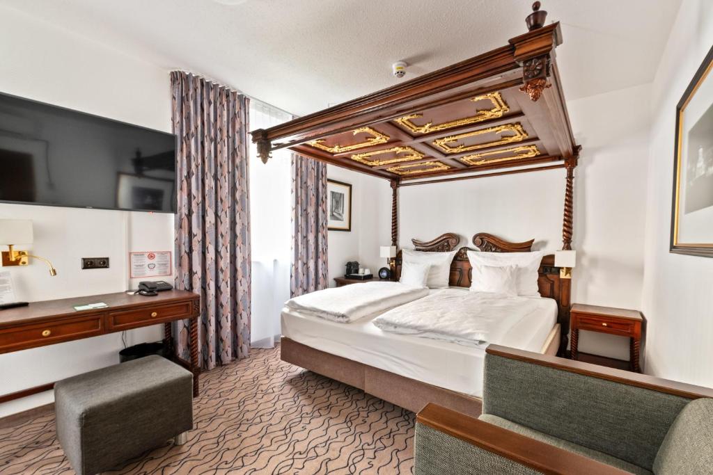 Postel nebo postele na pokoji v ubytování King's Hotel Center Superior