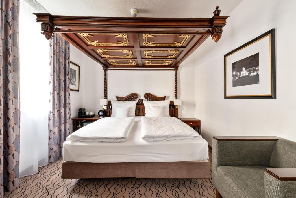 Postel nebo postele na pokoji v ubytování King's Hotel Center Superior