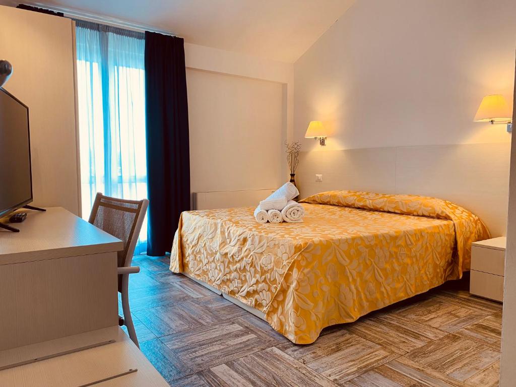 Postel nebo postele na pokoji v ubytování Hotel Muita di Mari